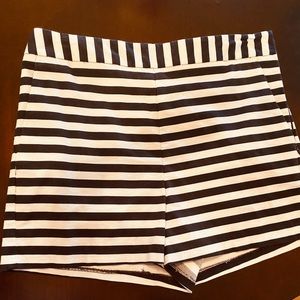 Express black and white striped shorts. Side zip.